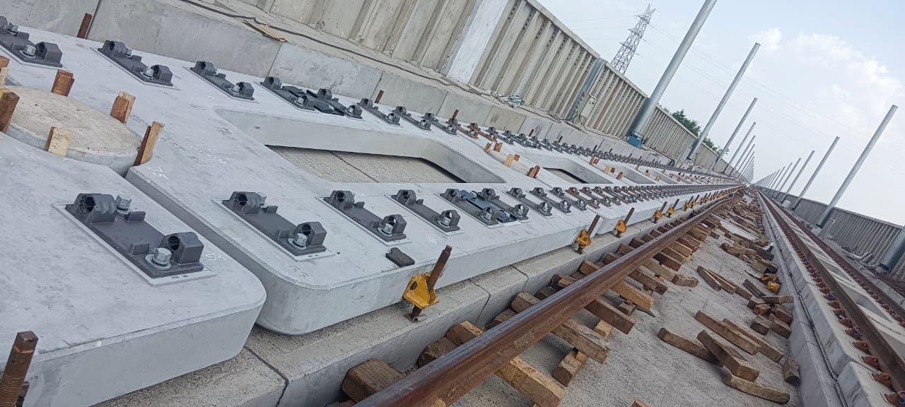 Close-up of precast sleeper fastenings and rail